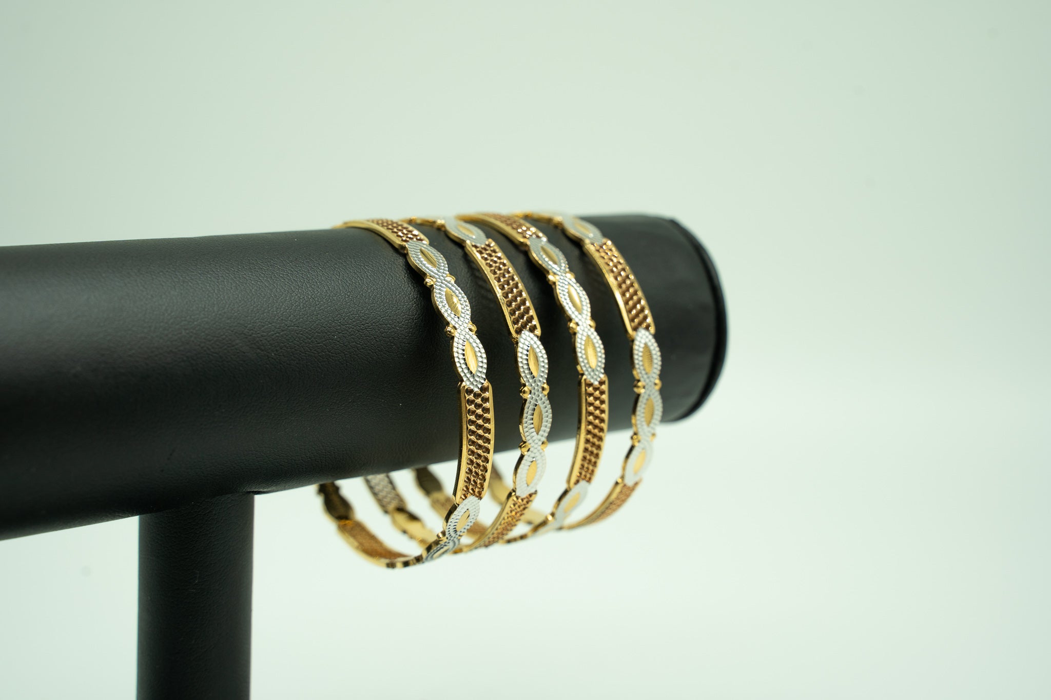 Infinity Design- Two Toned 22k Gold Set of 4 Bangles